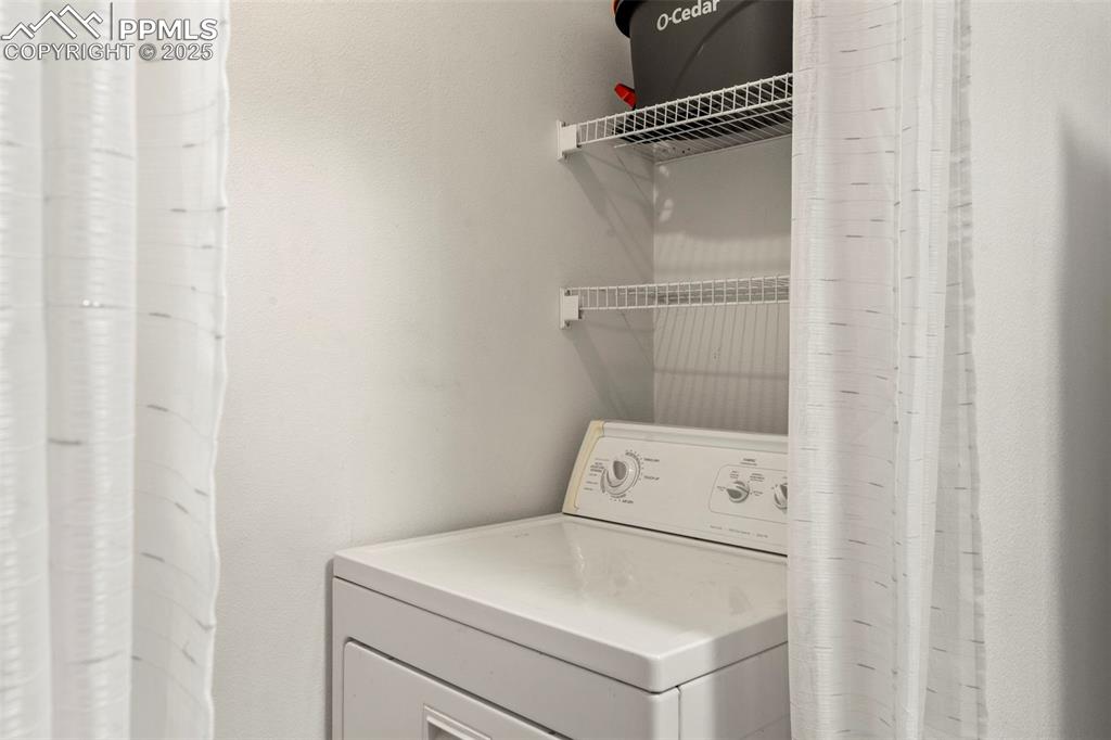 Image 9 of 15: Washroom with washer / clothes dryer