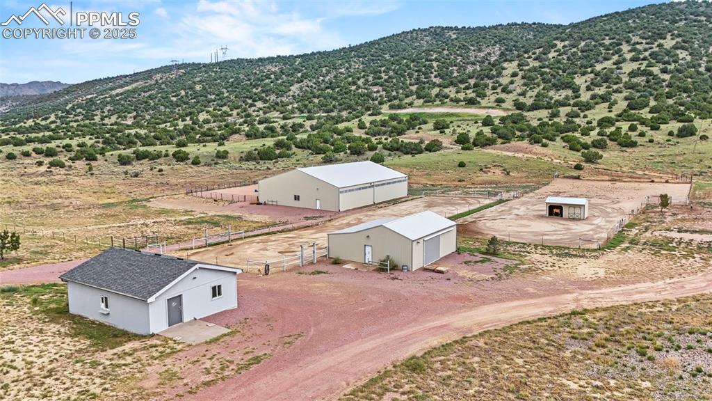 Image 6 of 41: Aerial view of sparsely populated area featuring mountains