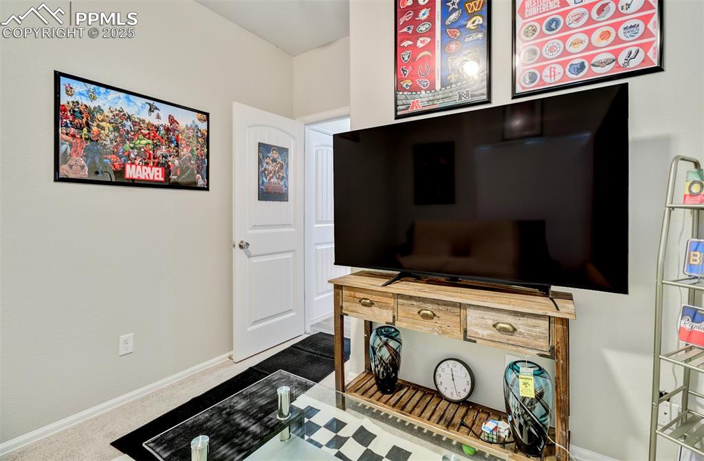 Image 19 of 35: Playroom featuring baseboards and carpet flooring