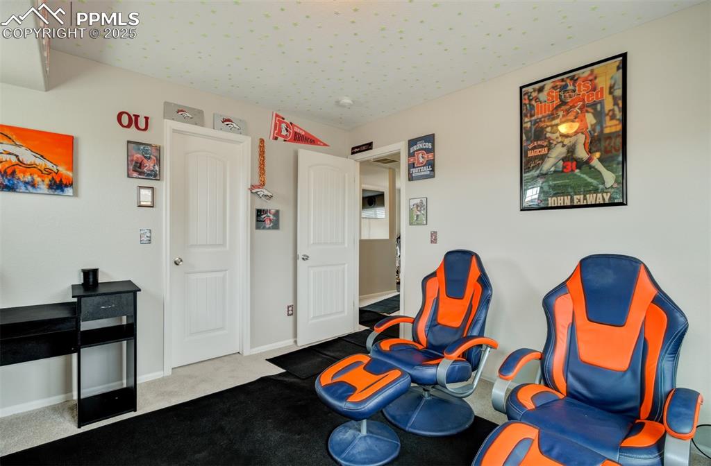 Image 21 of 35: Sitting room featuring carpet flooring and baseboards