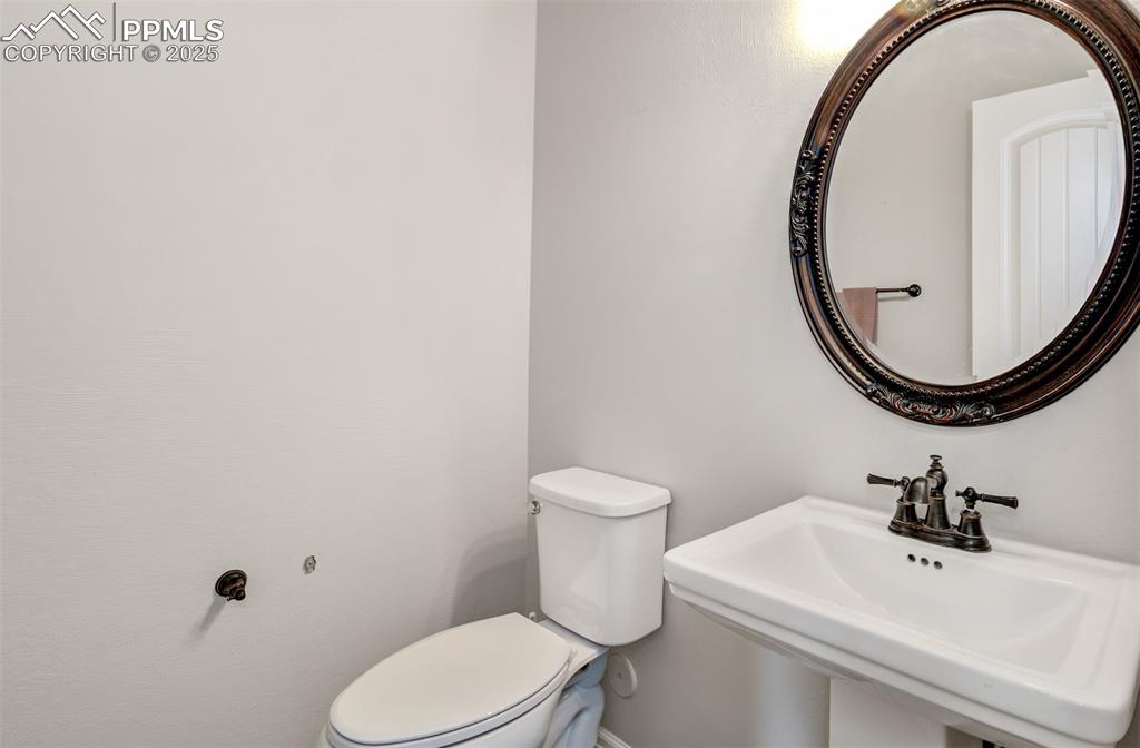 Image 23 of 35: Bathroom featuring toilet and a sink