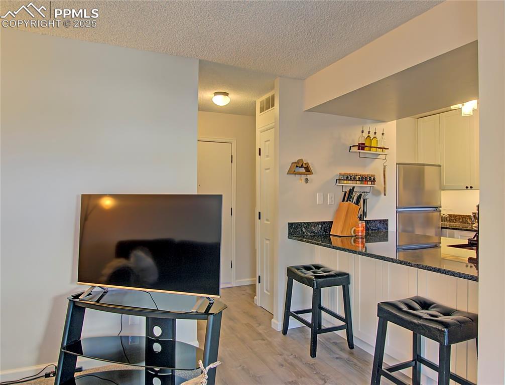 Image 12 of 30: Door on left leads to the hallway....door on the right is a coat closet. Th