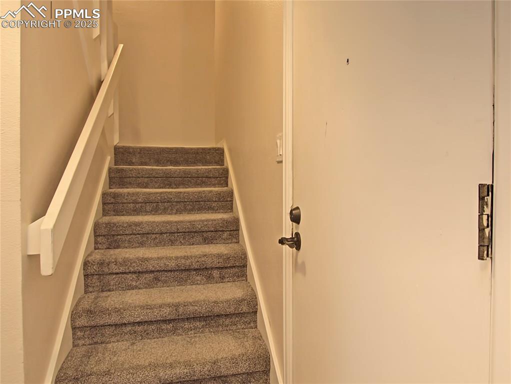 Image 14 of 30: Head upstairs to the bedrooms...newer carpet throughout 
