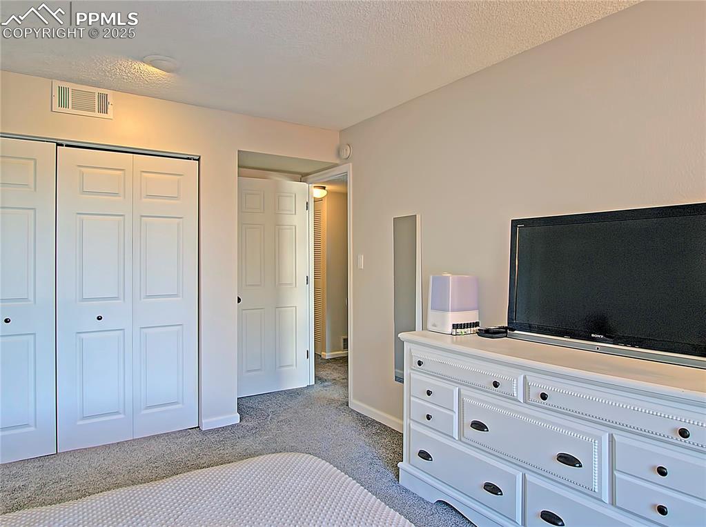Image 16 of 30: Large bedroom with closet