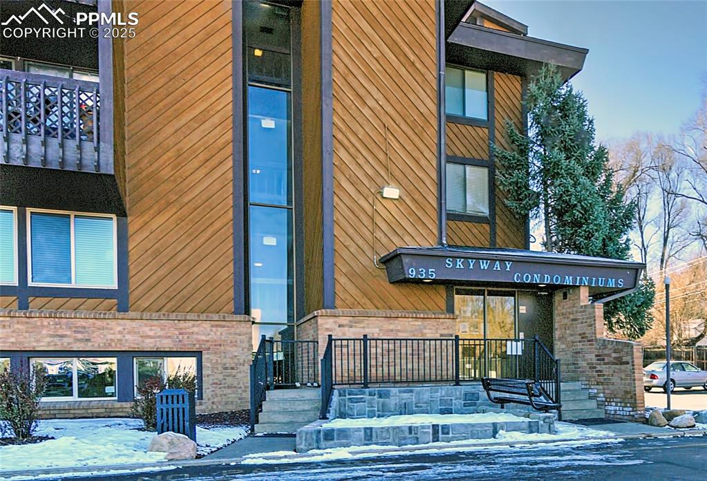 Image 24 of 30: Guest parking is located just across from this main entrance. 