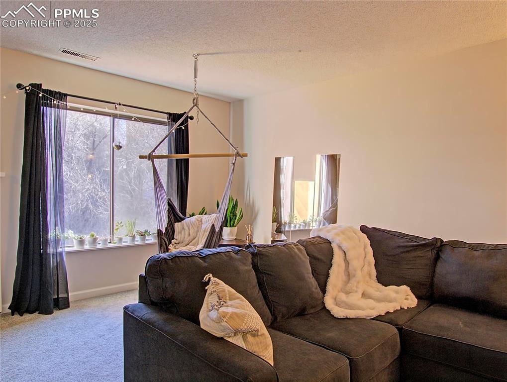 Image 3 of 30: Large window brings in the sunshine.