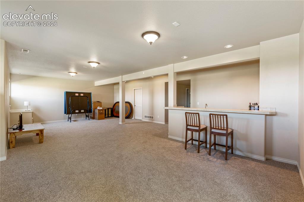 Image 20 of 31: Gas fireplace in family room in basement