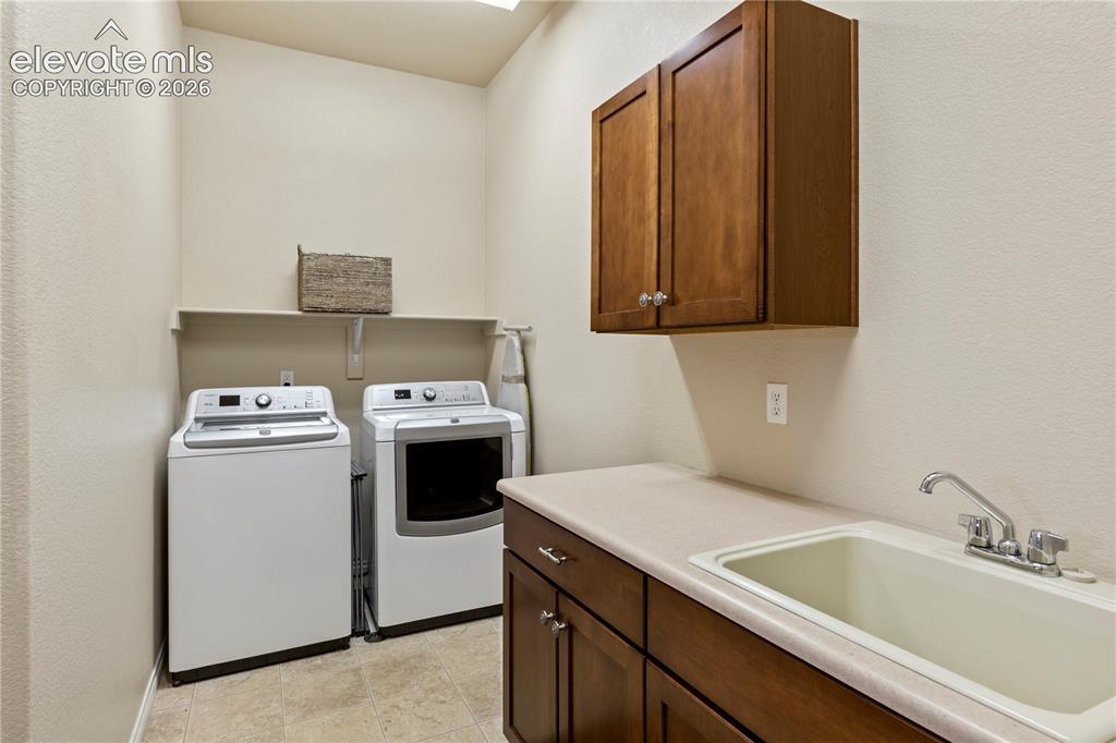 Image 23 of 31: Wet bar in walkout basement
