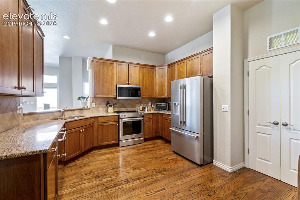 Image 7 of 31: Beautiful oak flooring throughout the main level