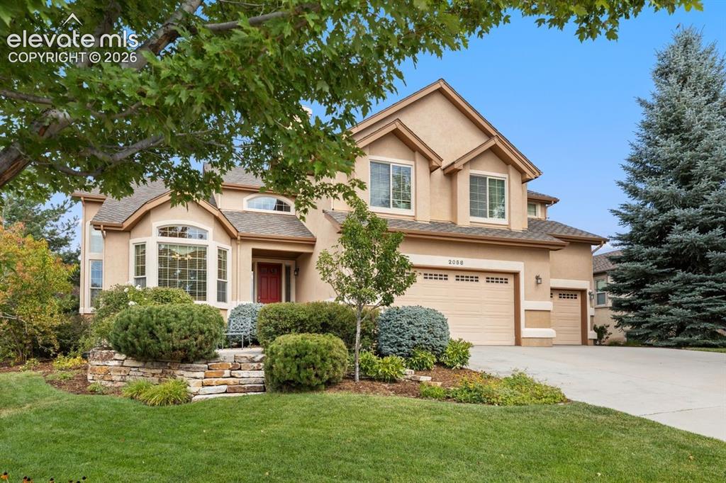 Image 1 of 50: Front of home with mature landscaping