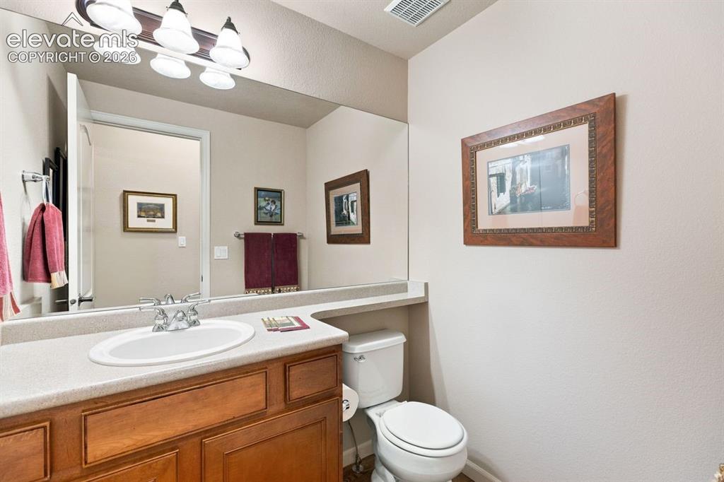 Image 15 of 50: Main level 1/2 bathroom