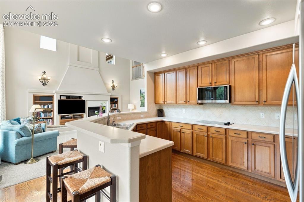 Image 2 of 50: Gourmet kitchen with double ovens, newer microwave, and new fridge