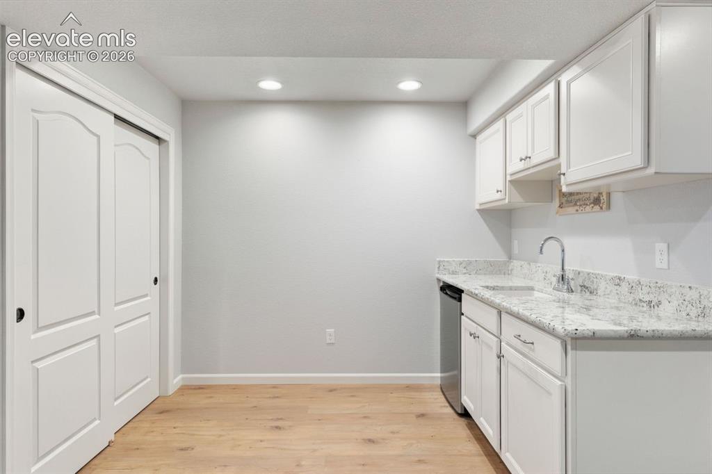 Image 29 of 50: Wet bar with included mini fridge (2nd kitchen)
