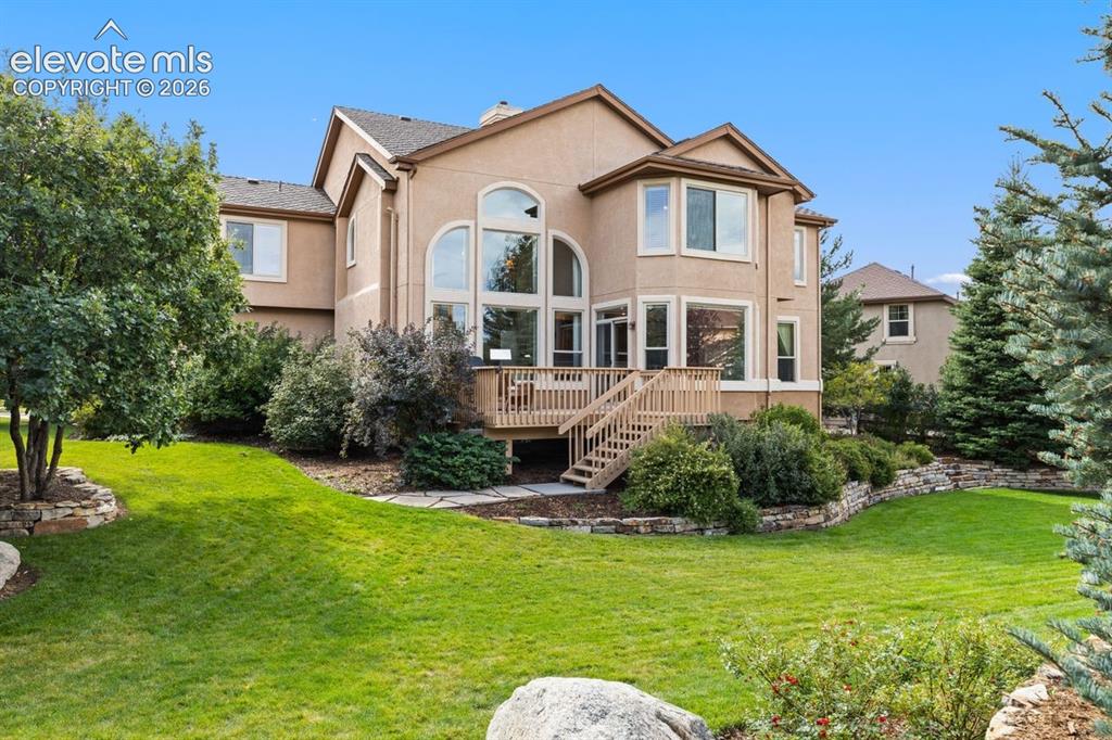 Image 42 of 50: Beautifully landscaped backyard