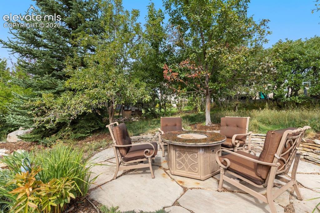 Image 44 of 50: Firepit area with included furniture