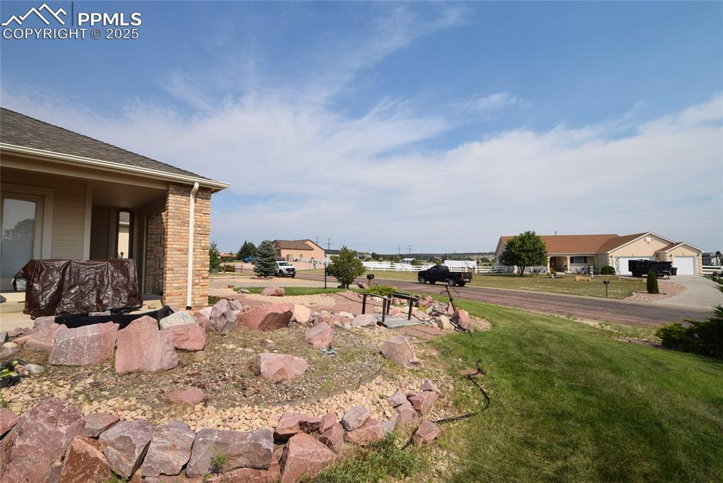 Image 2 of 50: View of grassy yard