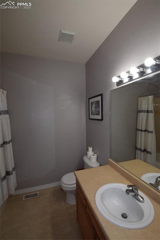 Image 20 of 50: Full bathroom featuring vanity and a shower with curtain