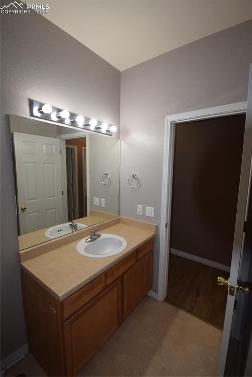 Image 22 of 50: Bathroom featuring vanity and tile patterned flooring