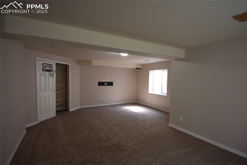 Image 36 of 50: Unfurnished room featuring carpet flooring and baseboards