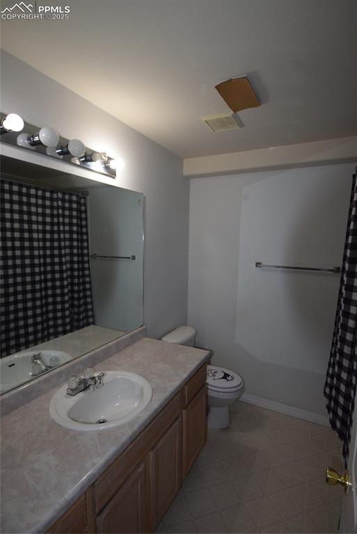 Image 43 of 50: Bathroom featuring vanity and tile patterned floors