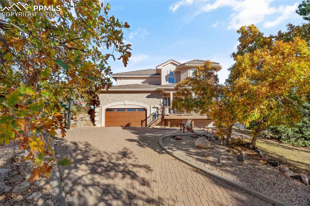 Image 2 of 49: Mediterranean / spanish-style house featuring decorative driveway and stucc
