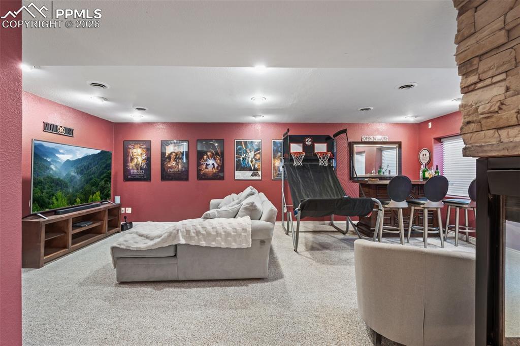 Image 34 of 49: Living area with carpet floors