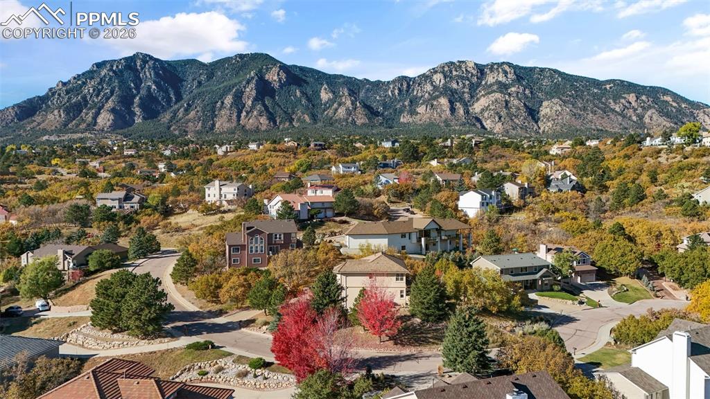Image 48 of 49: Aerial view of residential area with mountains
