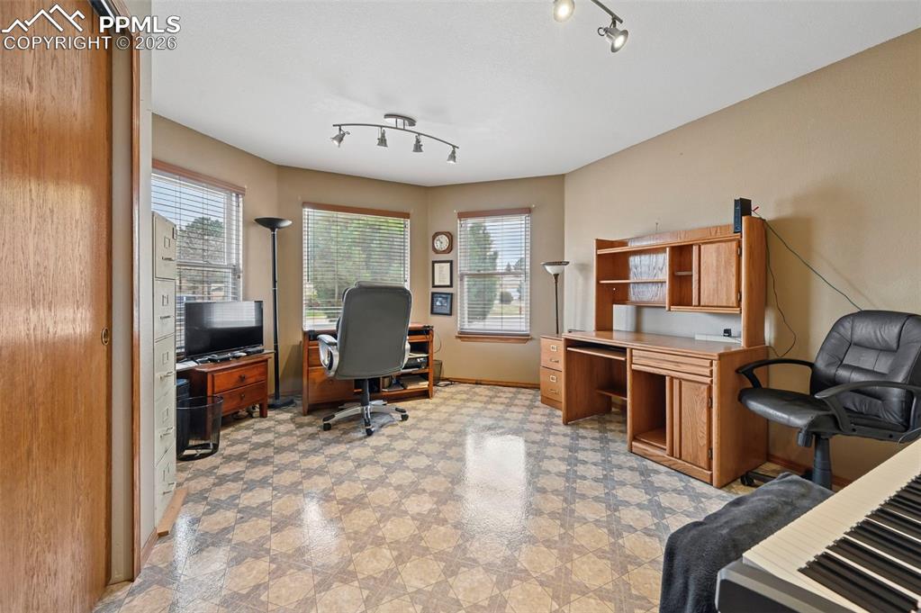 Image 7 of 43: Bedroom used as an office.