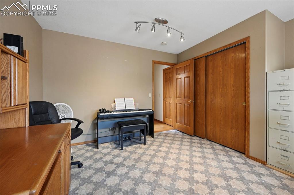 Image 8 of 43: Bedroom used as an office.