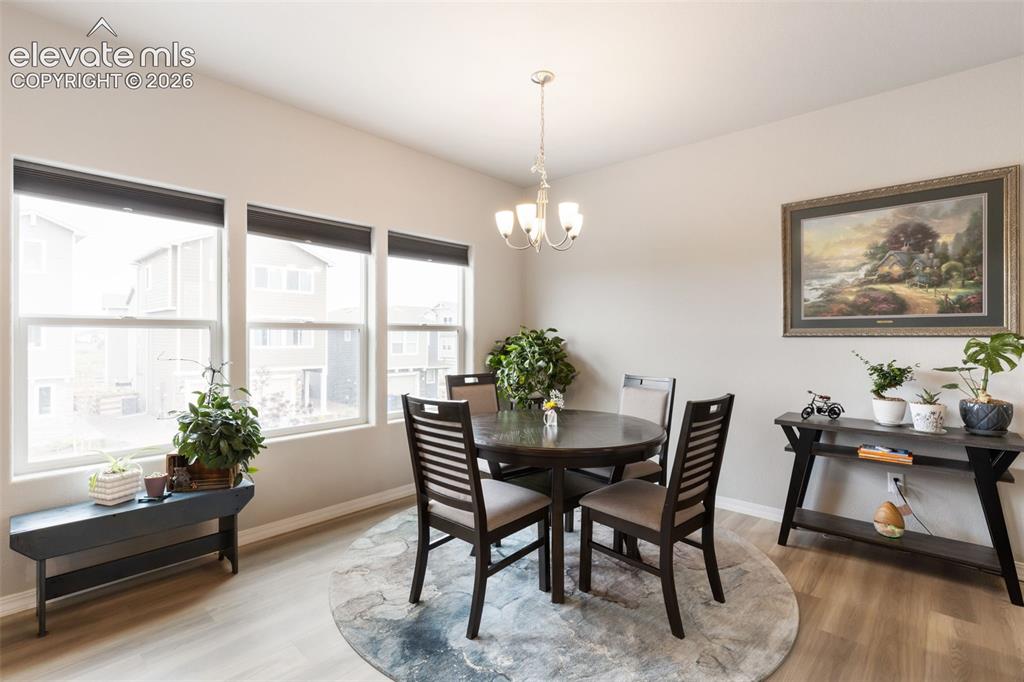 Image 11 of 28: Dining space featuring a warm neutral color palette and abundant natural li