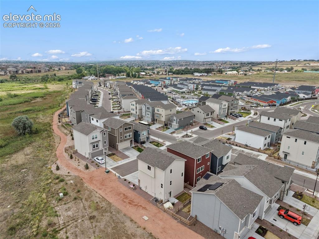 Image 27 of 28: View of neighborhood showing pool and layout