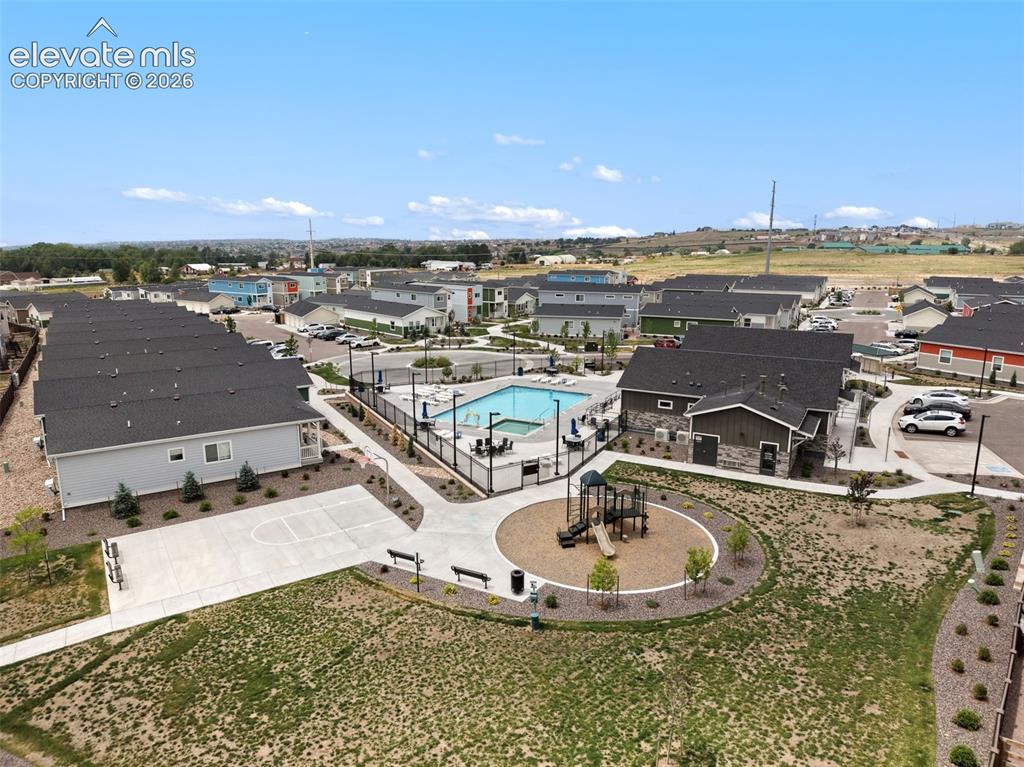 Image 28 of 28: View of neighborhood showing pool and layout