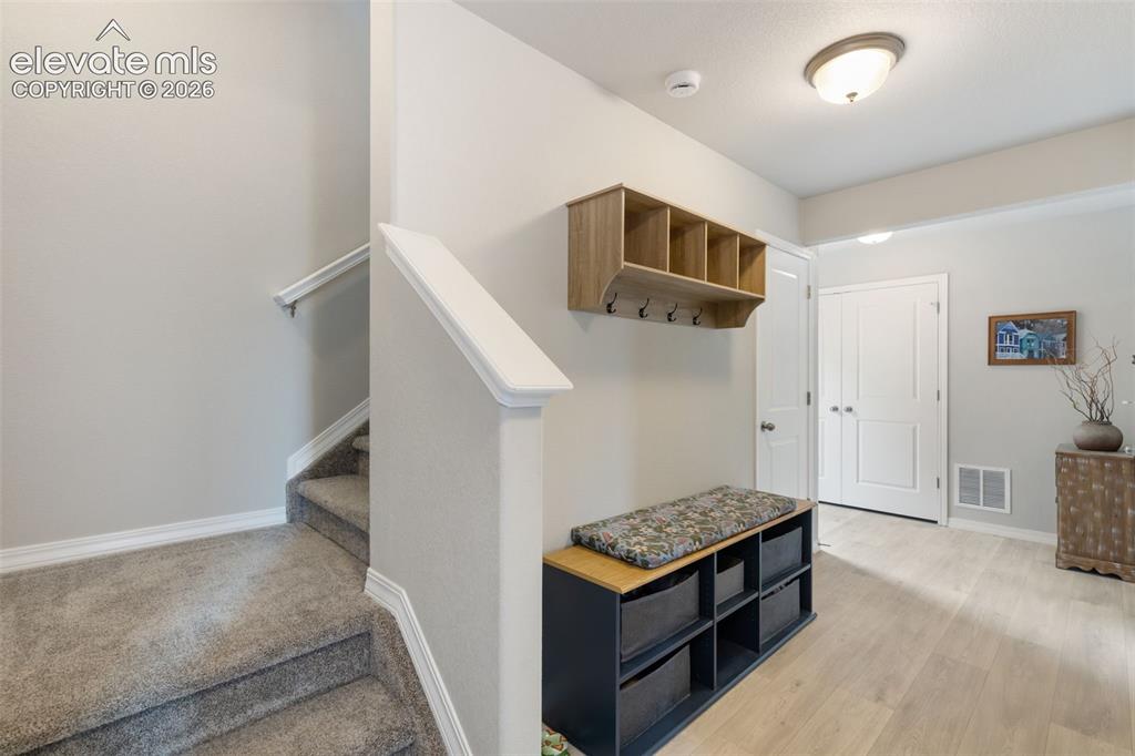 Image 4 of 28: Entryway/mudroom area with closet space