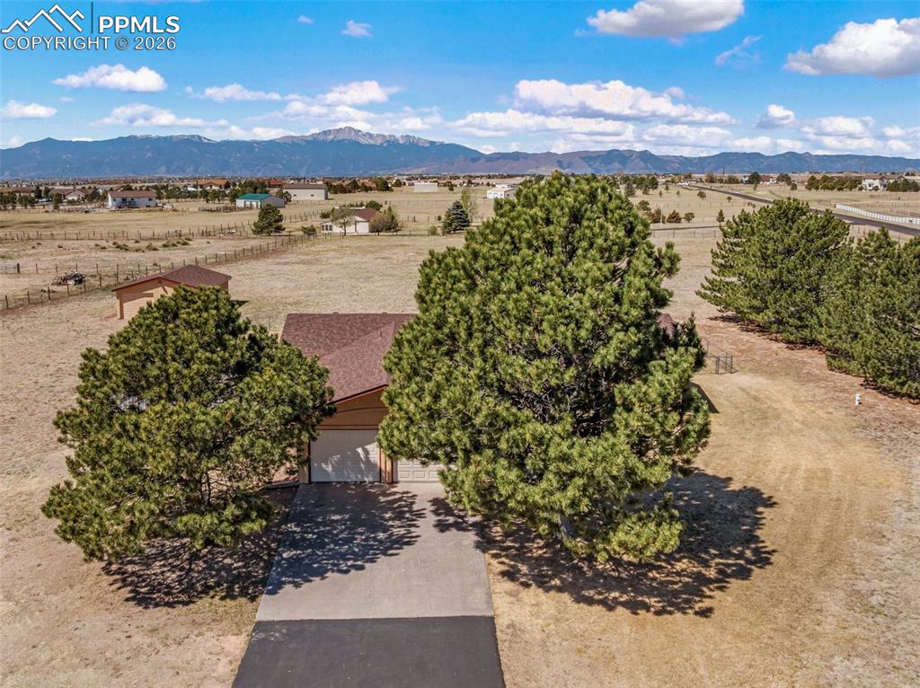 Caption: Rare opportunity to own a ranch home on 5.3 acres.  The surrounding area around the front of the hom