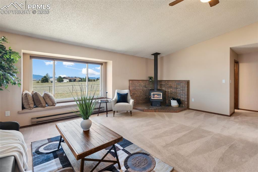 Image 14 of 50: Private concrete patio with privacy fence