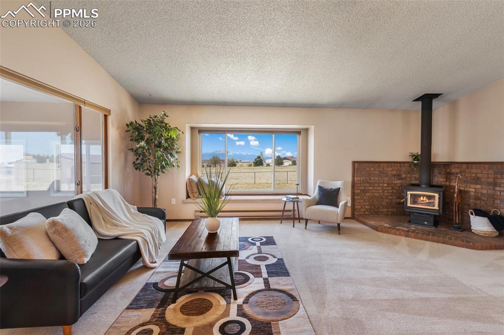 Image 15 of 50: Spacious living room with Pikes Peak views