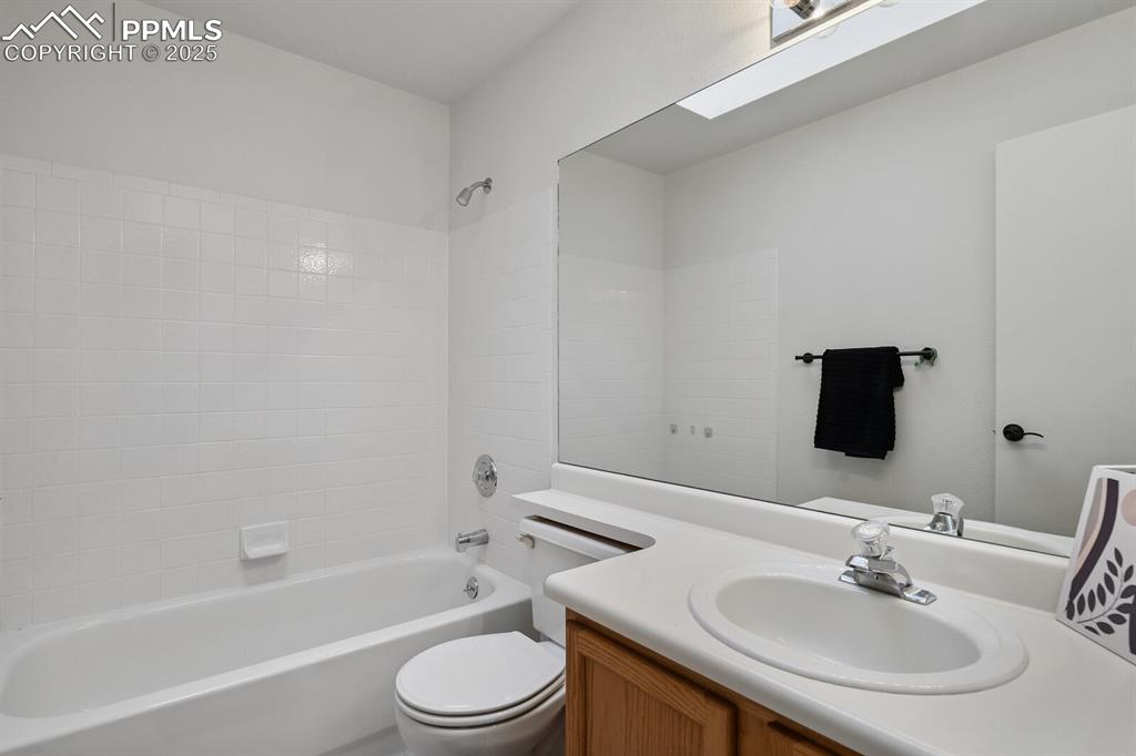 Image 26 of 45: Bathroom featuring vanity and shower / bath combination