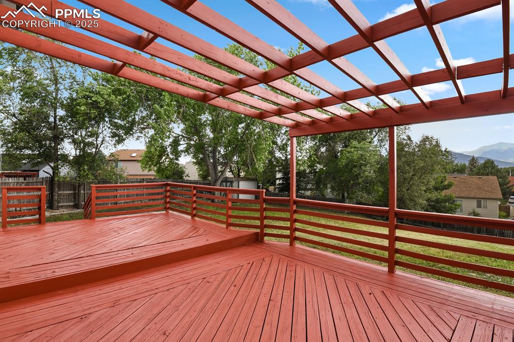 Image 38 of 45: Wooden deck featuring a mountain view