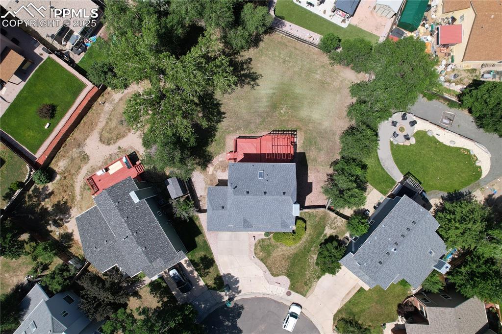 Image 45 of 45: Aerial view of property and surrounding area with a mountain backdrop and n