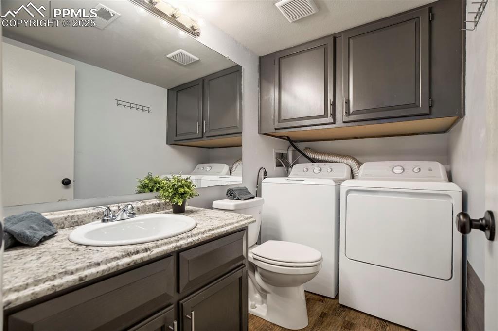 Image 21 of 36: Lower Level Half Bathroom, W/D Included