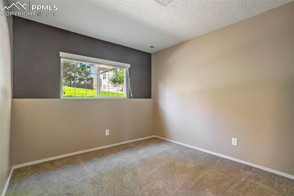 Image 22 of 36: Lower Level Bedroom