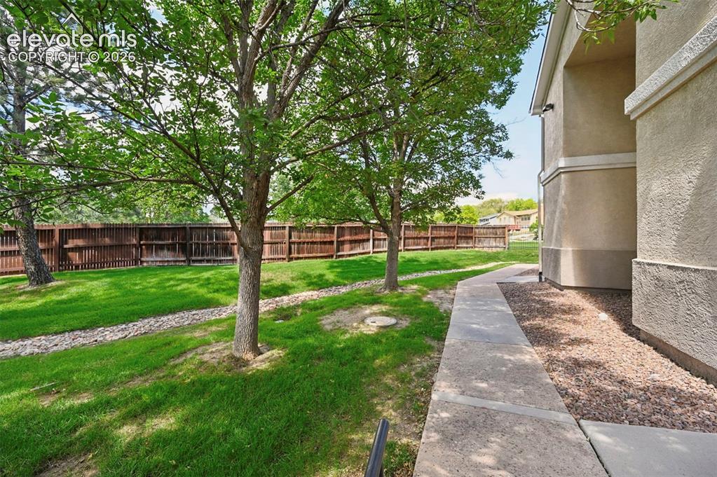 Image 2 of 48: Beautifully landscaped secluded green space