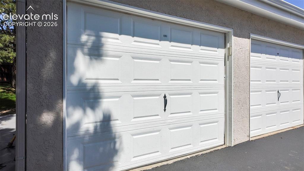 Image 25 of 48: Owned one-car garage conveniently located steps away from home