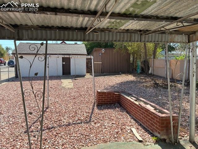 Image 2 of 13: View of yard with a shed