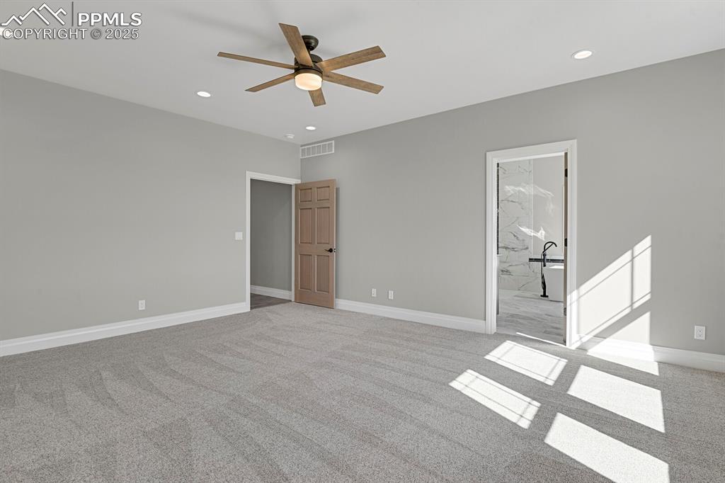 Image 17 of 44: Primary bedroom w/view of access to bathroom