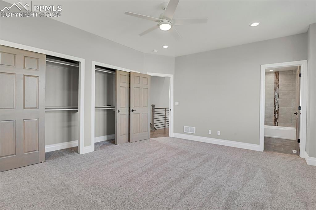 Image 21 of 44: Double closet and access to full bathroom in secondary suite