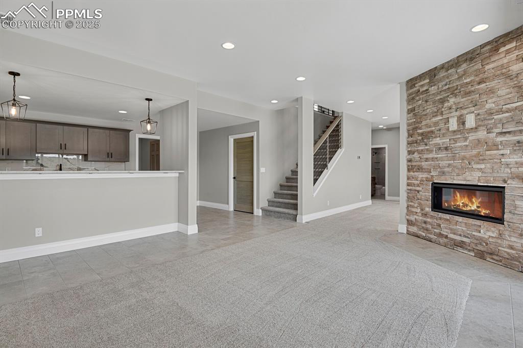 Image 26 of 44: view of family room and wet bar from patio door