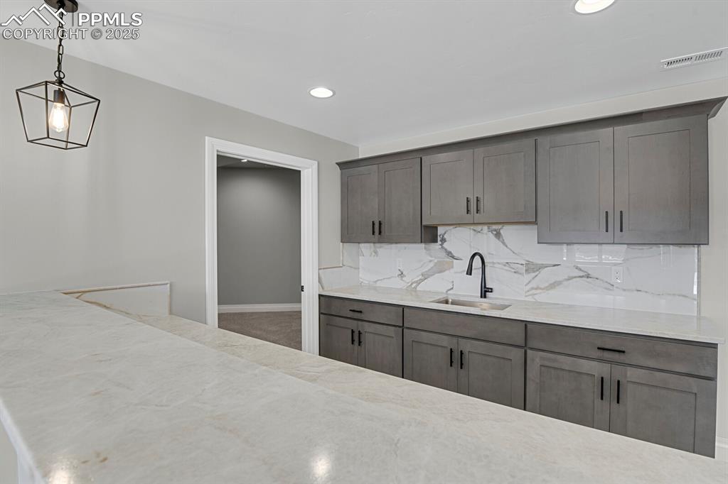 Image 27 of 44: Great storage and space in the basement wet bar