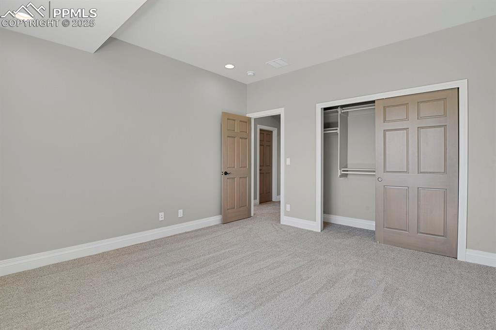 Image 36 of 44: Closet and entry view of bedroom #4