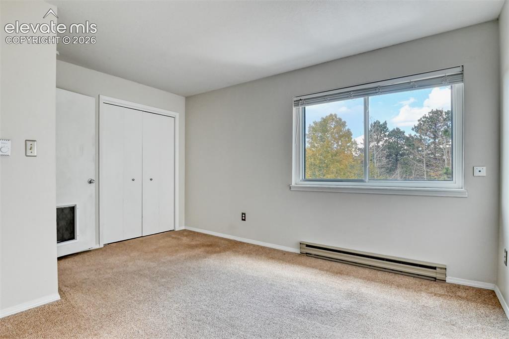 Image 25 of 50: Neutral wall colors with carpeting